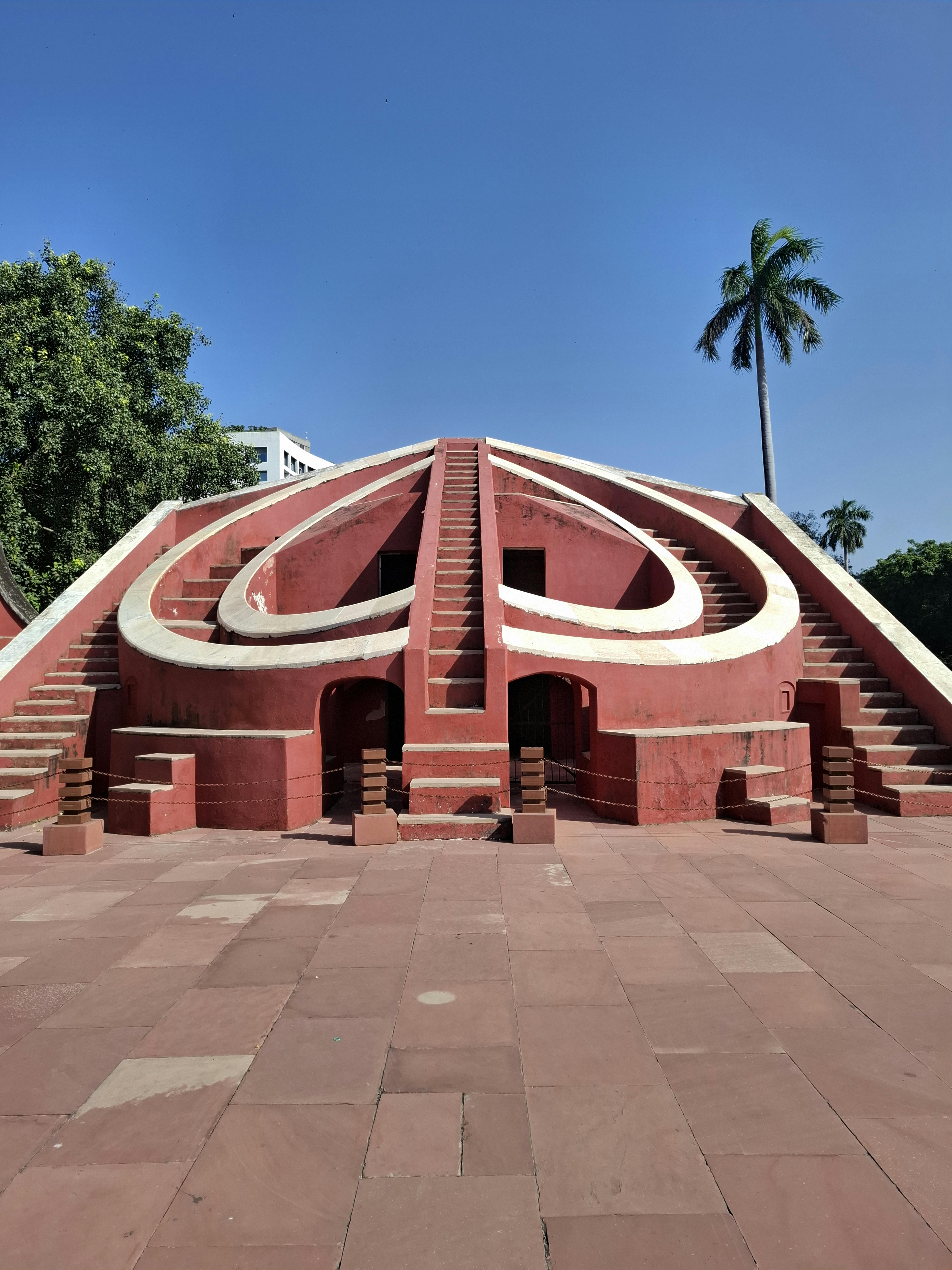 Explore the historic Jantar Mantar astronomical structure in Kota, Rajasthan on a clear sunny day.